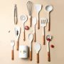 Silicone kitchen utensil set with wooden handle.