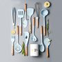 Silicone kitchen utensil set with wooden handle.
